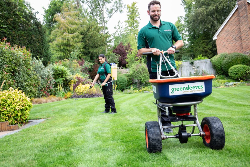 Greensleeves lawn experts completing treatment on lawn