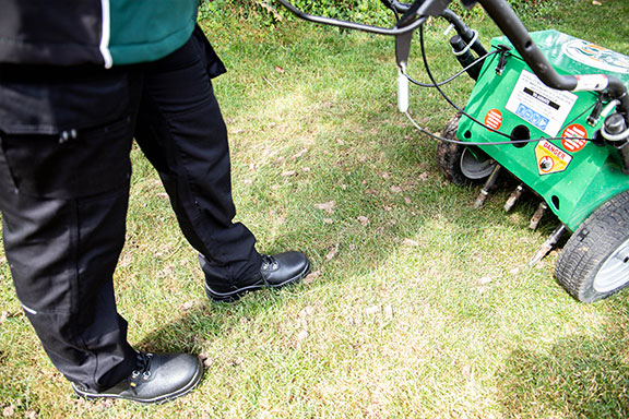 Close up shot of the rear of an aeration machine showing how it works