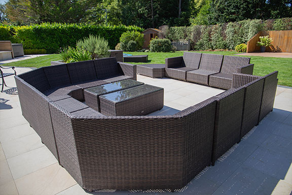 Large brown outdoor seating area in a garden