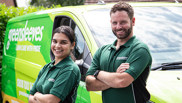 Greensleeves lawn experts stood in front of branded van