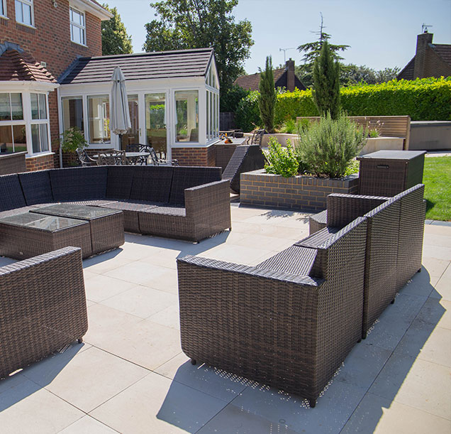 Garden with outdoor patio seating area and conservatory