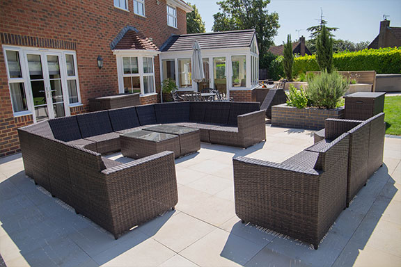 Large brown outdoor seating area in a garden