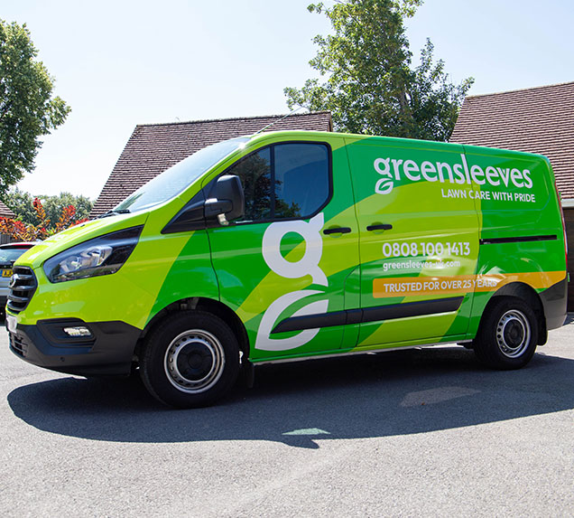 Side of the Greensleeves van with branding and contact information