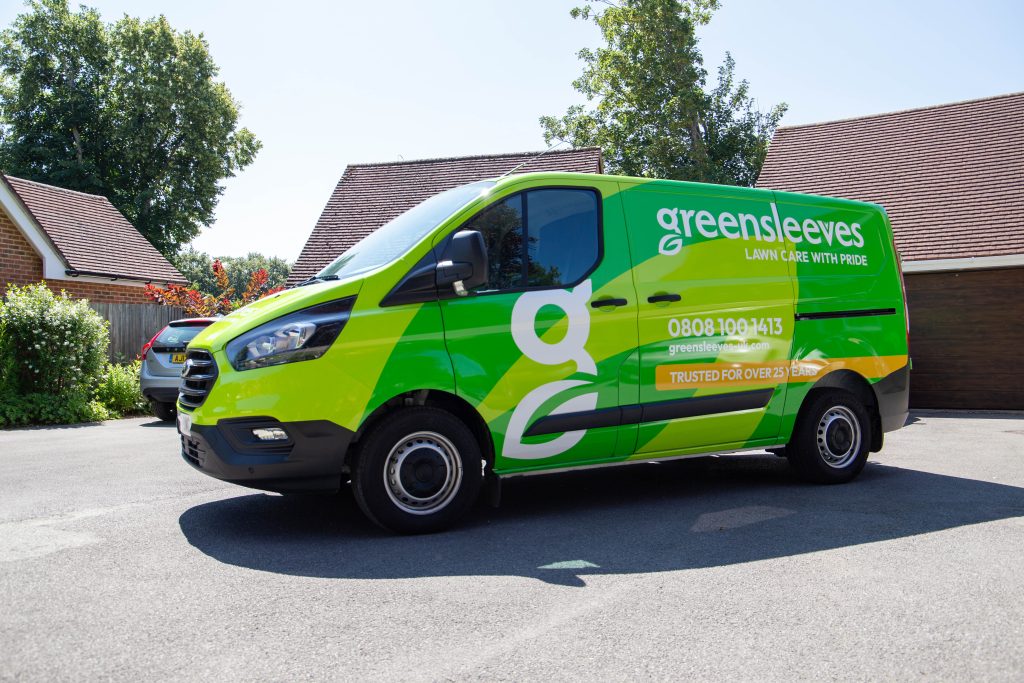 Greensleeves lawn care branded van parked on a driveway