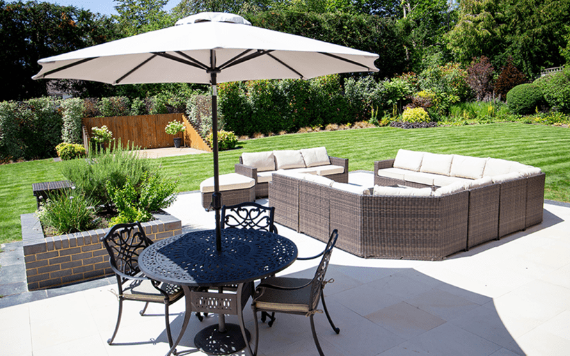 patio furniture with green lawn in background